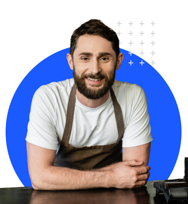 man wearing apron smiling